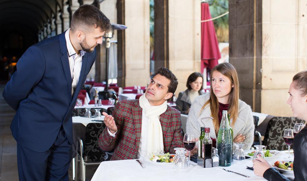 Angry guests talking to a manager