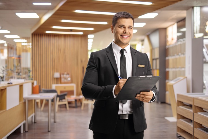 a hotel receptionist smiling 