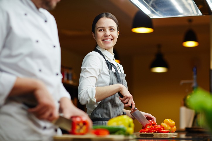 two chefs chopping vegetables