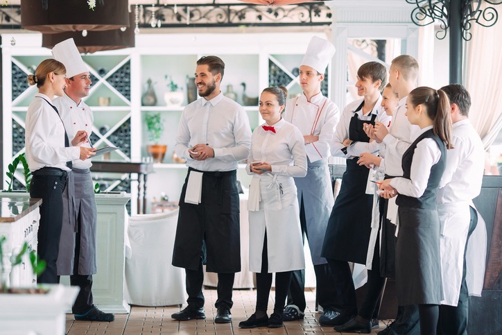 Restaurant manager and his staff on the terrace
