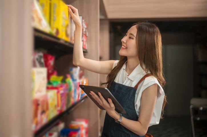 a woman using a tablet checking stock or sale inventory