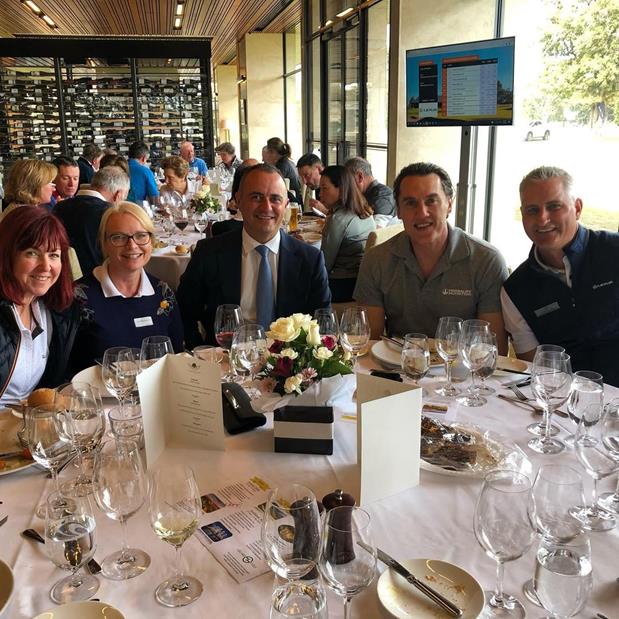 A group of people in a busy restaurant