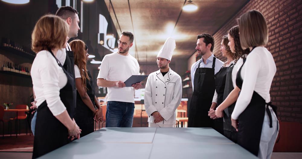 Collaborative Multiracial Restaurant Staff Meeting