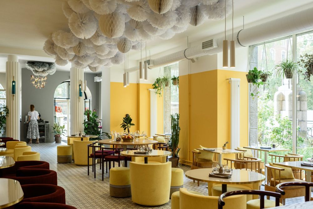 Image of a stylish restaurant with big windows and a yellow theme