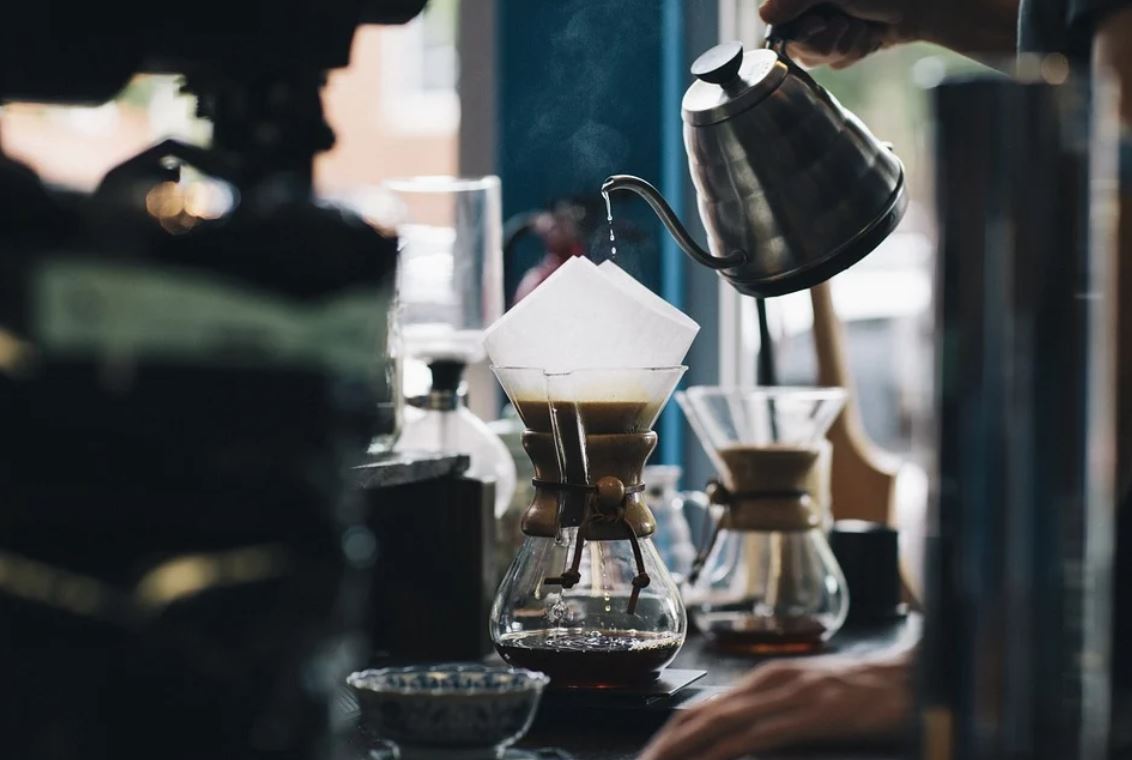Image of a server pouring coffee in a restaurant