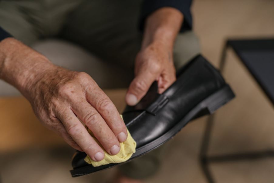 a-person-polishing-a-shoe