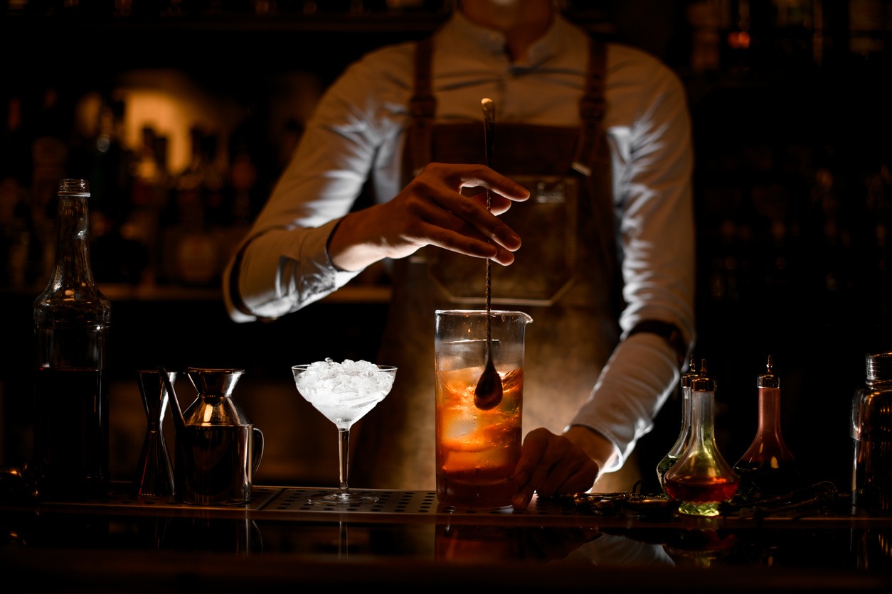 a bartender stirring a drink
